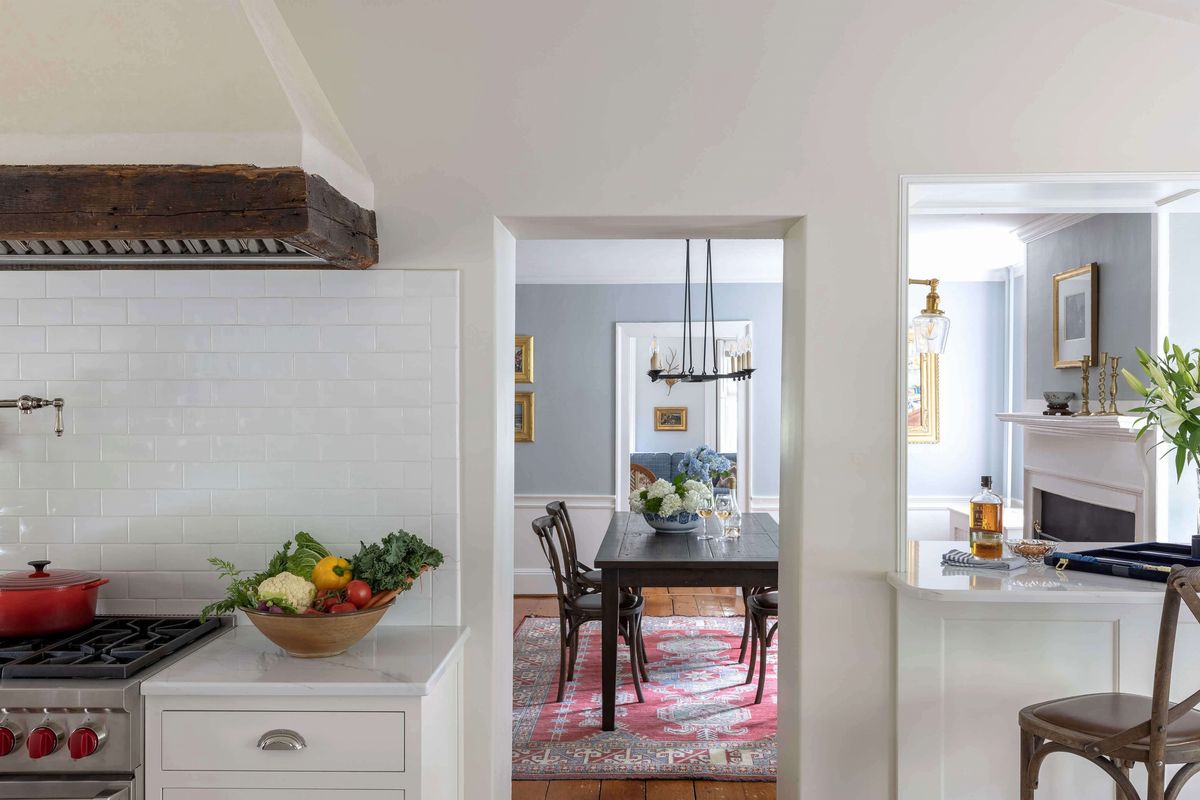 View to colonial dining room from white kitchen