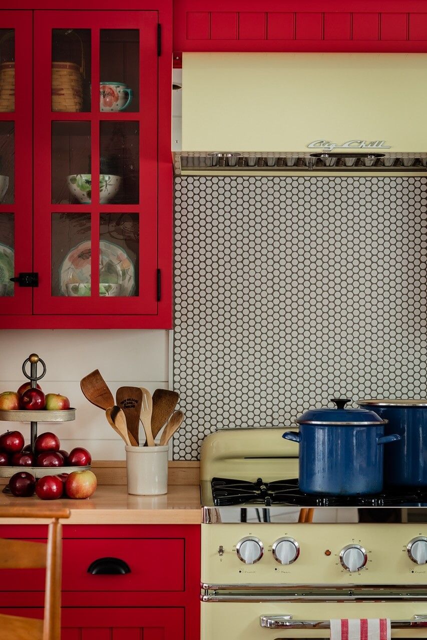 Guest house retro kitchen with red cabinets detail