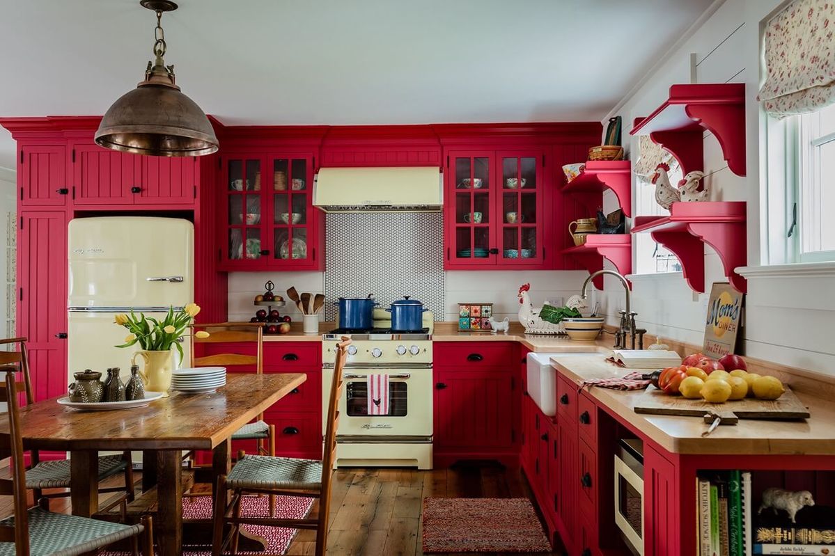 Guest house retro kitchen with red cabinets