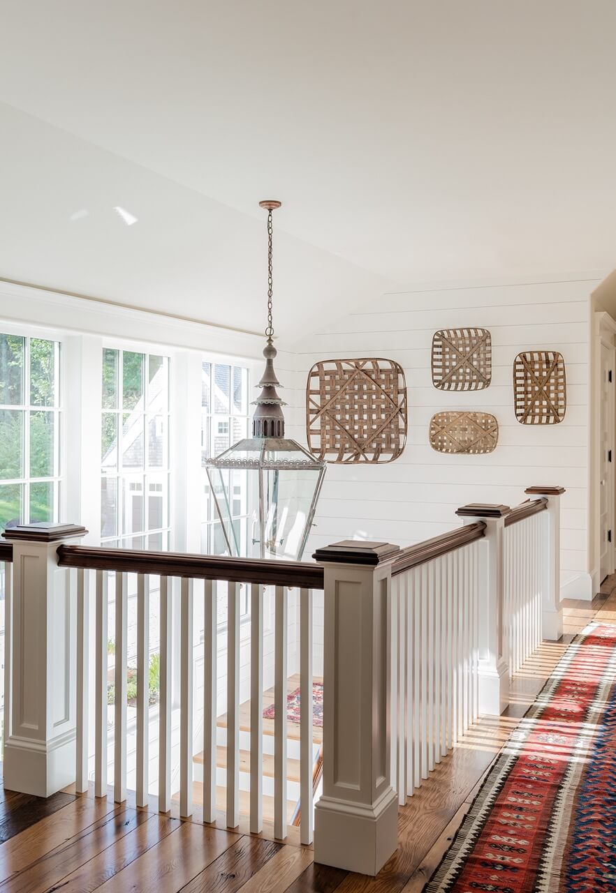 Hallway with large lantern and baskets on wall