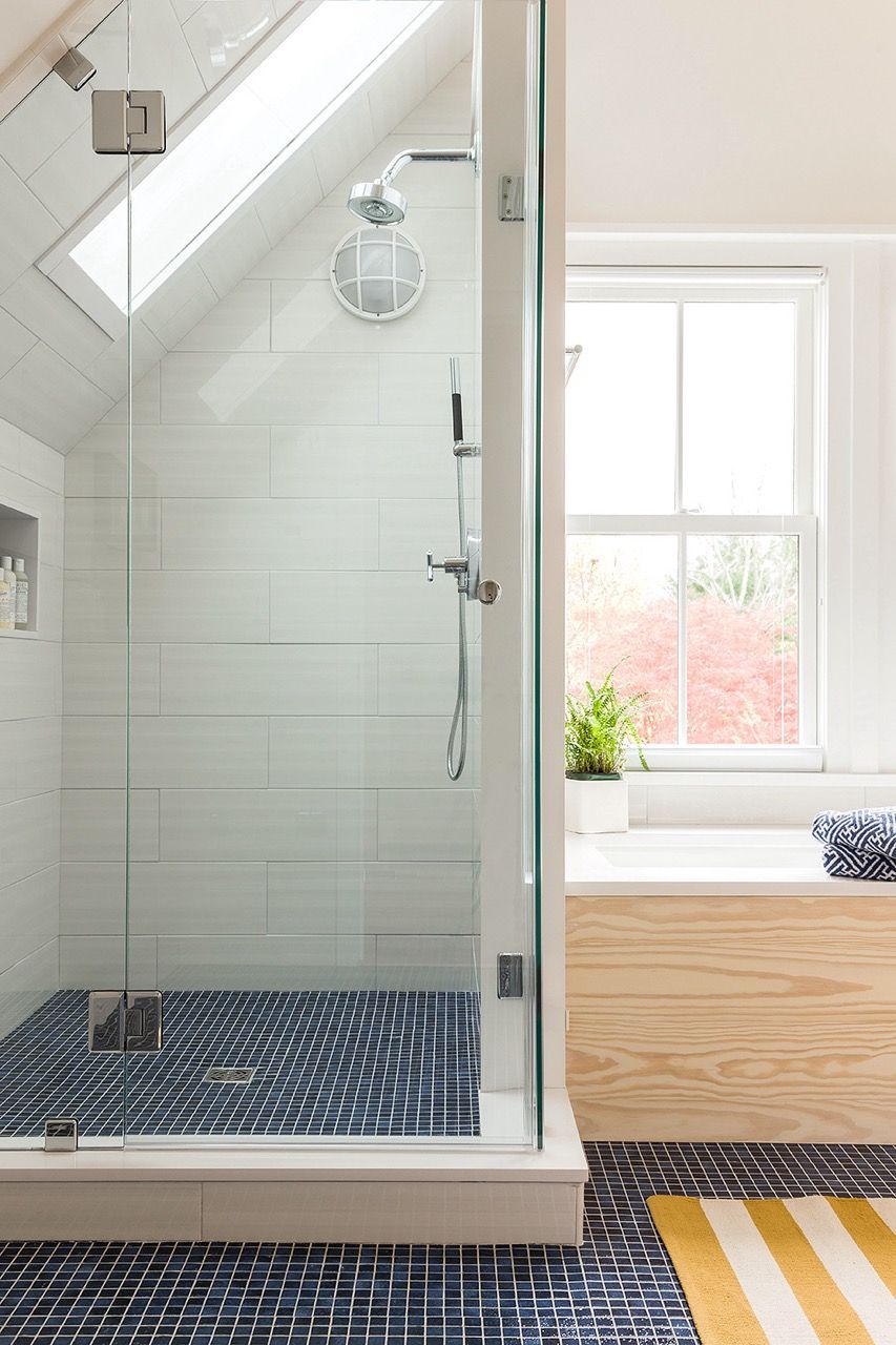 Blue and white shower built into roof eaves