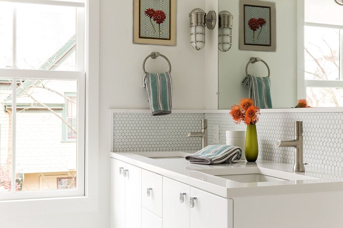 Full bathroom double sinks with penny round tile