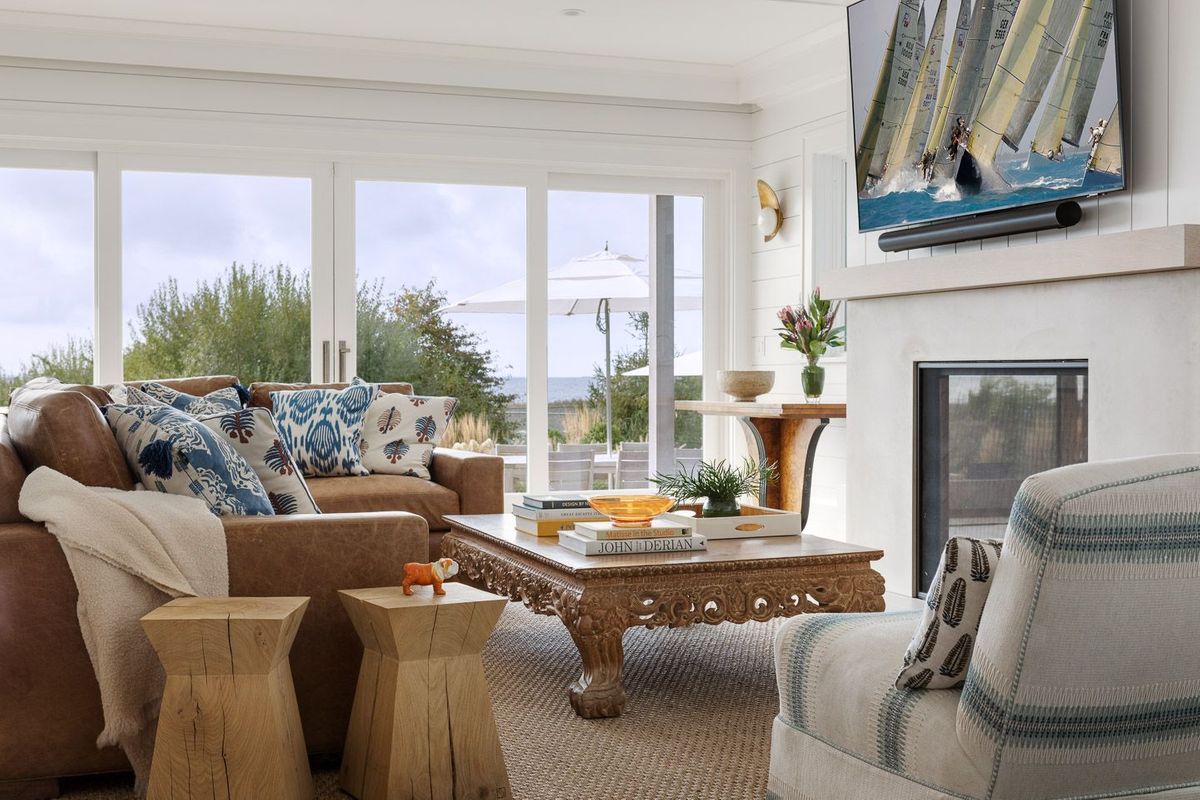 Coastal living room with brown leather sofa