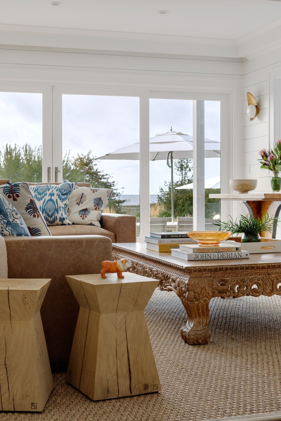 Coastal living room with carved coffee table