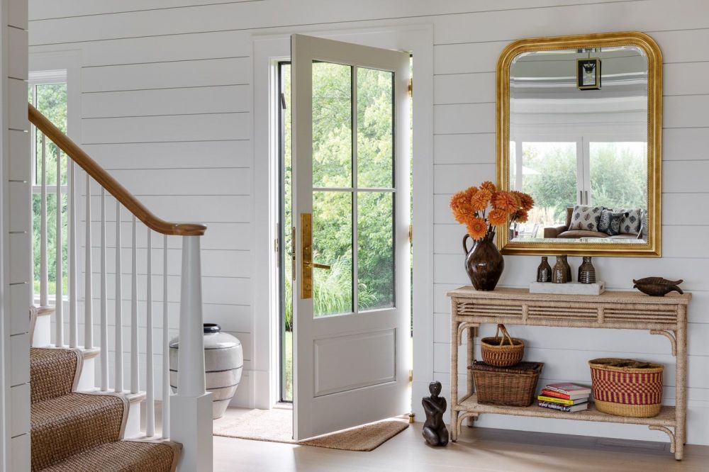 Entry hall with console table and gold mirror
