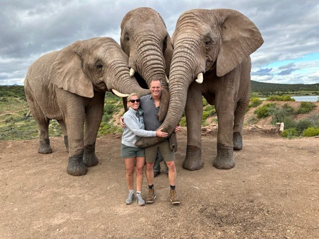 Kathy and Scott with new elephant friends on safari