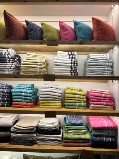 Shelves filled with colorful textiles