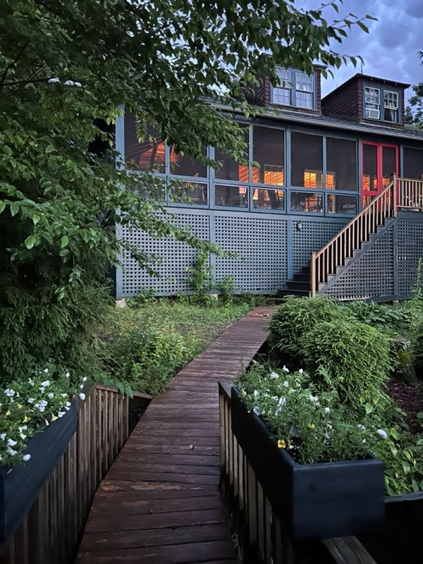 Lake house at dusk with the lights on