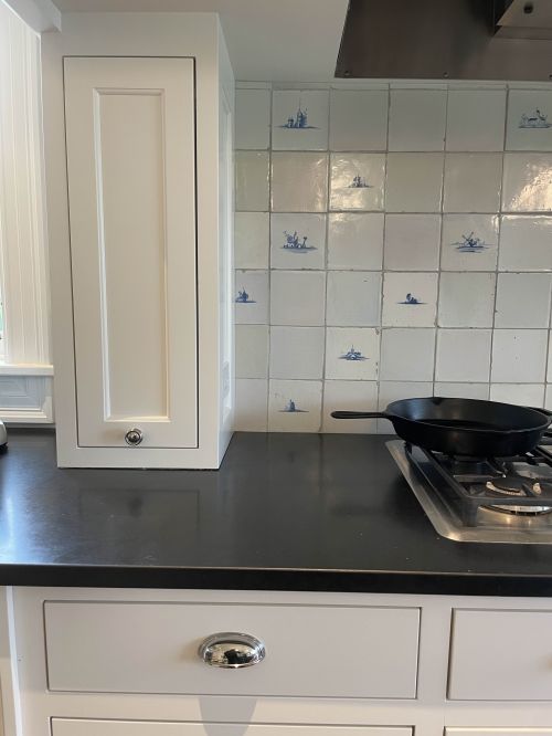 Antique Delft tile backsplash detail