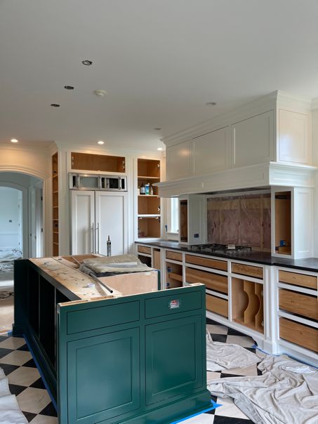 Work in progress kitchen with green island
