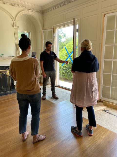 Carpenter talks to designer and client about restoration