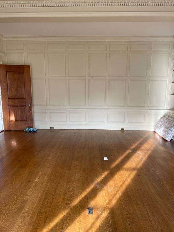 Family room paneled wall before modification