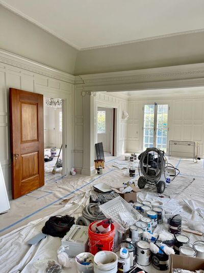 Back parlor and living room during painting