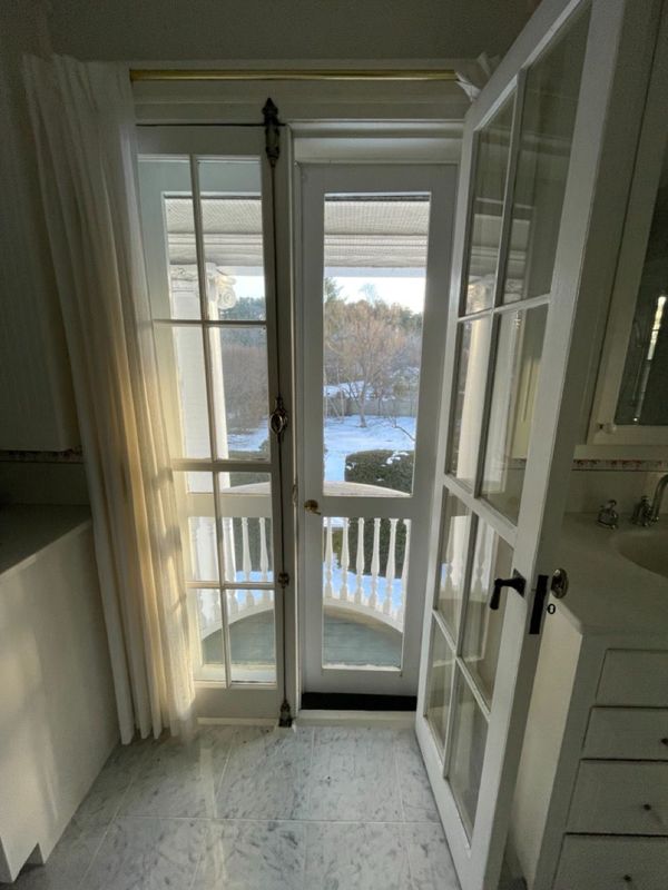 French door open with screen door in tact