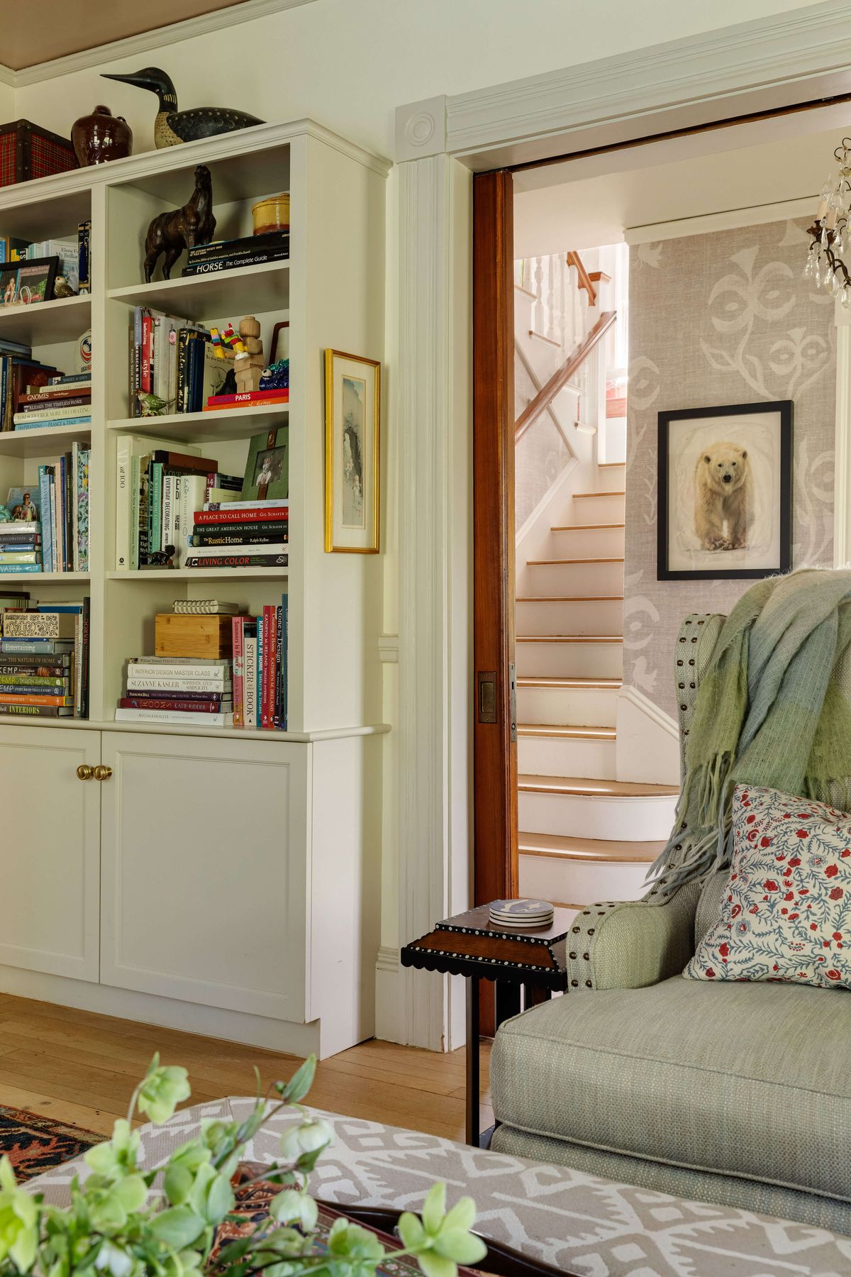 View from Family Room to Main Stair with built-in bookcase