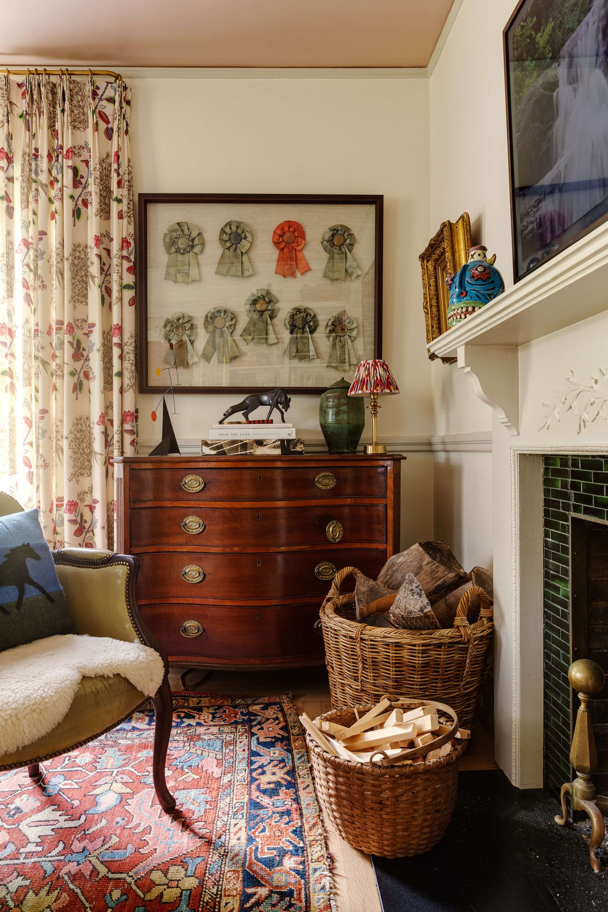 Riding ribbons on display above antique chest of drawers