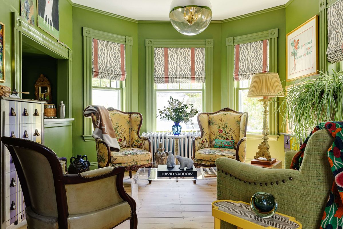 Living Room with French antique armchairs and natural oak floors
