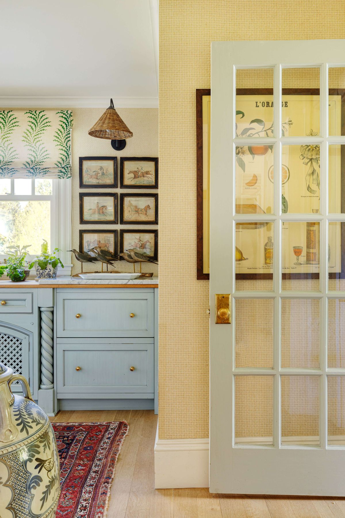 White French door into yellow and blue Butlers Pantry