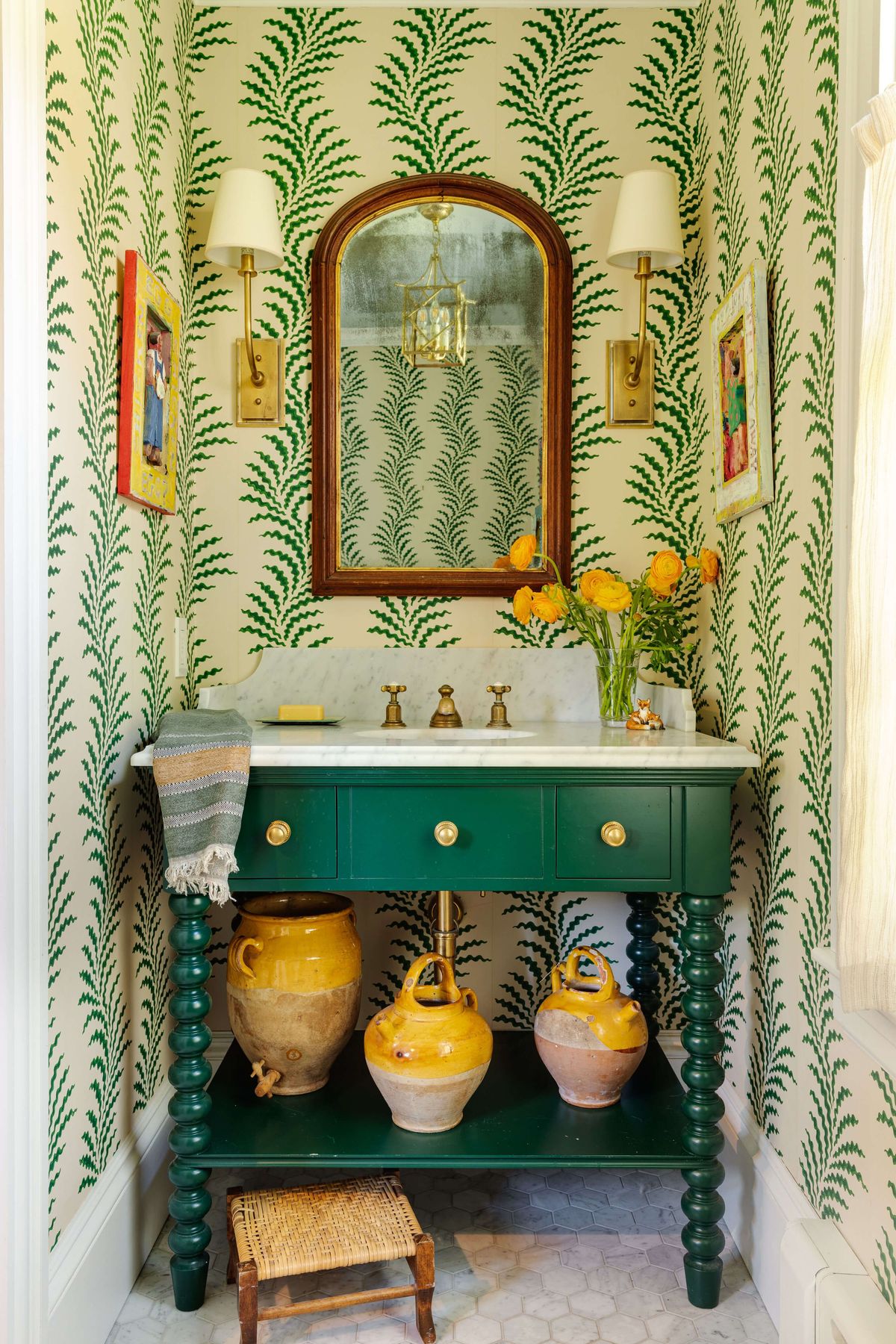 Powder Room with green and white wallpaper and French pottery